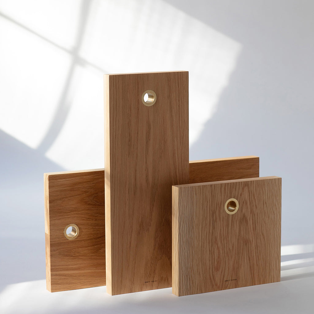 White Oak solid wood serving boards with brass ring. Handmade in Vancouver BC by Brett Yarish