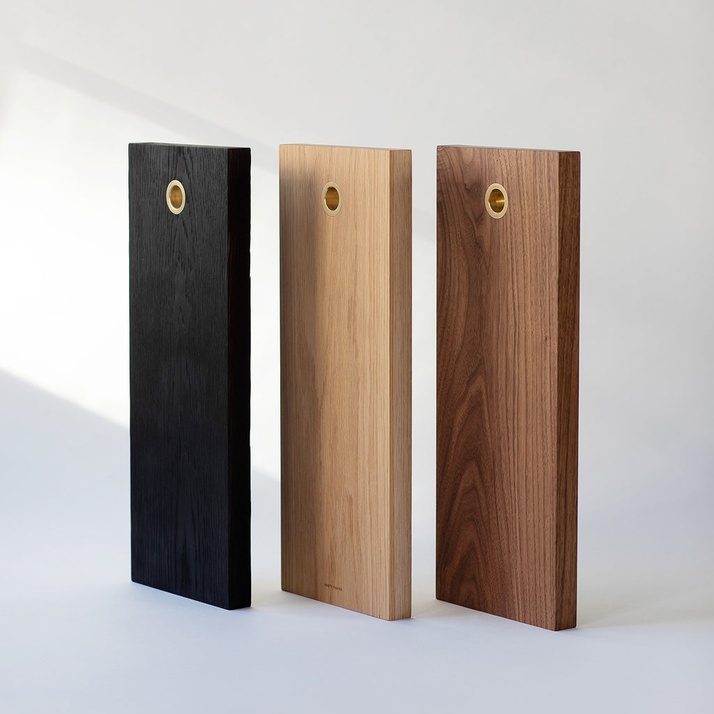 Charred Oak, White Oak and Black Walnut solid wood serving boards with brass ring. Handmade in Vancouver BC by Brett Yarish