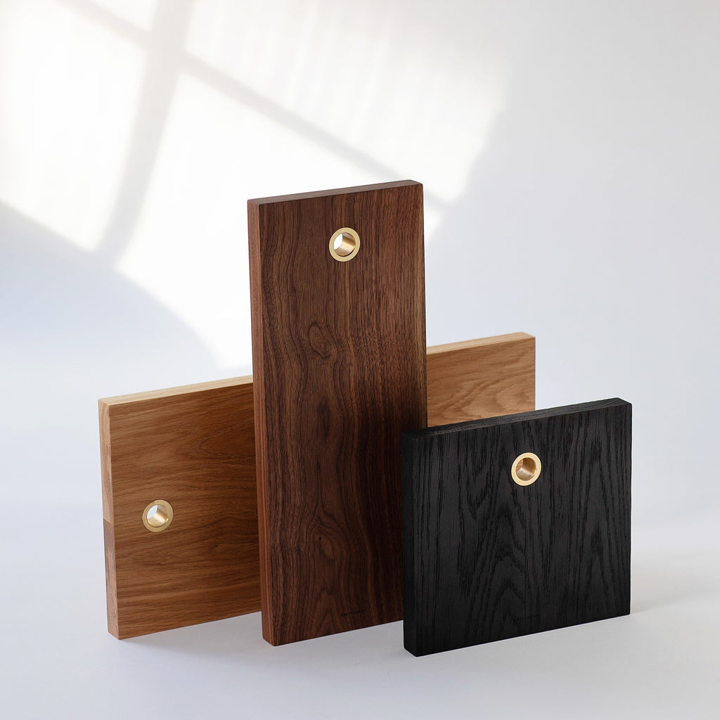 Charred Oak, White Oak and Black Walnut solid wood serving boards with brass ring. Handmade in Vancouver BC by Brett Yarish